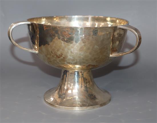 A George V planished silver tri-handled pedestal bowl by William Hutton & Sons, Sheffield, 1912, 8 oz.